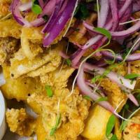Leche De Tigre Ceviche · Street ceviche with swai fish, fried calamari, fried shrimp, plantain chips