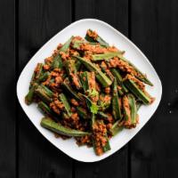 Fried Okra Masala · Okra fried in a spiced tangy base with onions, tomatoes, and ground spices.