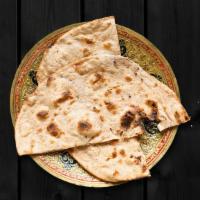 Tandoori Roti · Whole wheat flat bread baked to perfection in an Indian clay oven.