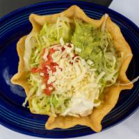 Taco Salad · Choice of beef or chicken with lettuce, tomatoes, sour cream and guacamole piled high in a c...