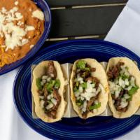 Street Tacos (3) · Three tacos in corn tortillas, choice of grilled steak, chicken, al pastor or carnitas. With...