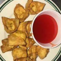 Fried Pork Wonton (8) · with sweet and sour sauce.
