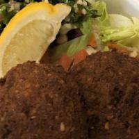 Falafel Pita Wrap · Fried chick pea patties with tahini sauce, lettuce, cucumbers, shredded carrots, shredded re...