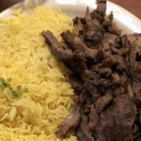 Beef Shawarma Plate · Thin slices of sirloin beef cooked rotisserie style. Served with salad and rice.