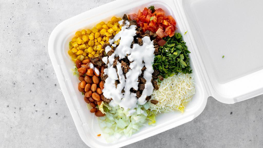 Burrito Bowl · Your choice of meat on a bed of rice and beans, topped with lettuce. tomato, cilantro, onion, corn, sour cream and shredded cheese.