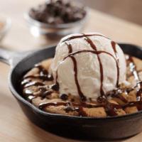 Skillet Cookie · 1160 cal. Fresh oven-baked chocolate chip cookie topped with yarnell's vanilla ice cream and...