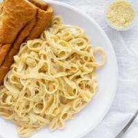 Fettuccine Alfredo · Fettuccine pasta tossed in a creamy Alfredo sauce.