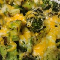 Broccoli Cheese Dinner · Generous portion of seasoned grilled broccoli topped with monetary and Colby Jack shredded c...