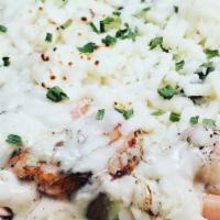 Shrimp Alfredo Potato · Grilled shrimp, homemade creamy alfredo sauce, sautéed mushrooms, sour cream, butter, roaste...