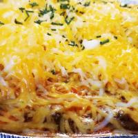 Chili Cheese Potato · Loaded with ½ pound of chili, butter, sour cream, raw onion, shredded cheese and chives!