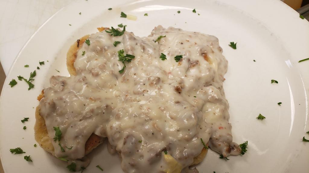 Biscuits And Gravy · Buttermilk biscuits covered with our creamy homemade sausage gravy. No searching for the sausage in our gravy! Served on Hash browns with 2 eggs for $3.99 more