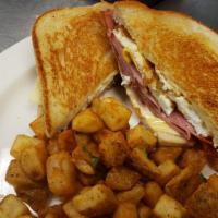 Breakfast Melt · Your choice of Ham, Bacon, or Sausage, 2 fried eggs, Swiss and American cheeses on thick-cut...