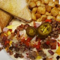 The Works Omelet · GIGANTIC 4 egg omelet loaded with everything but the kitchen sink. Ham, bacon and sausage, h...