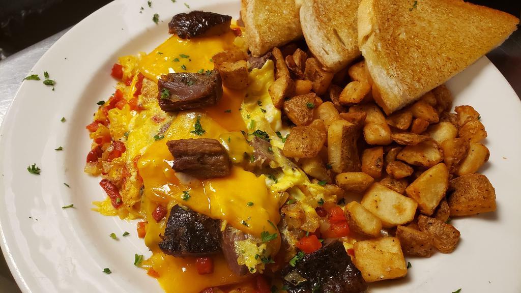 Ranchers Omelet · Beef brisket, grilled onion, red bell pepper, and Smoked cheddar cheese. Served with choice of potato and toast.