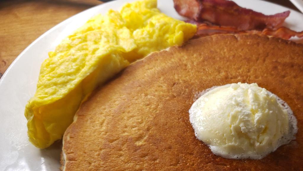 Double Pancake Platter · 2 of our giant cakes with your choice of breakfast meat, eggs, butter and syrup