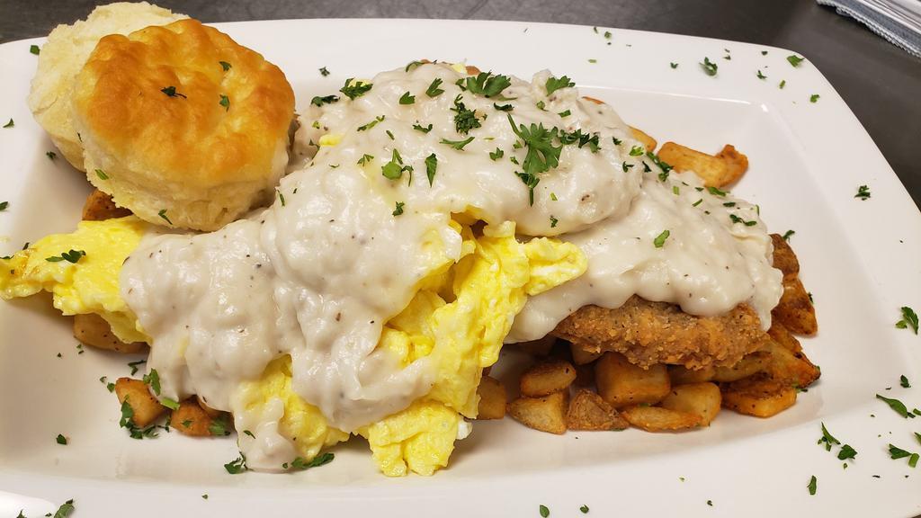 Big Country Skillet · A country-fried steak smothered in our delicious sausage gravy and served on top of fried country potatoes and topped with 2 eggs cooked how you like served with choice of toast.