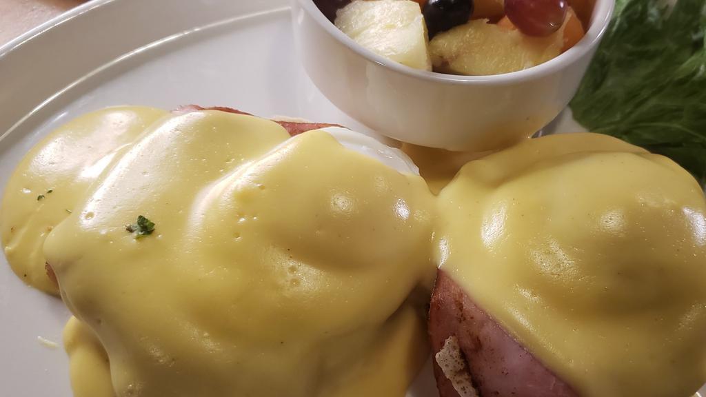 Classic Eggs Benedict · Hard to beat the Classic!  English Muffin, Canadian Bacon, eggs, and Hollandaise.  Served with your choice of potato.