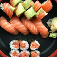 Salmon Lovers · Salmon nigiri (4pc), Sunrise Roll (8pc) and your choice of salmon skin roll (5pc) OR fresh s...