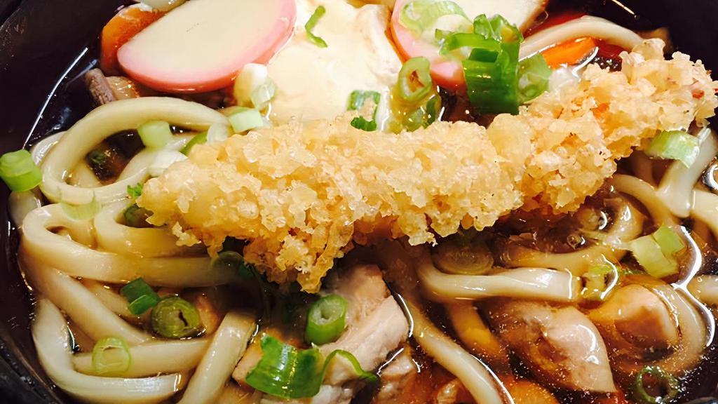 Nabeyaki Udon · Shrimp tempura, chicken thigh meat, fishcake, egg, carrots, green onion and shiitake mushroom over udon soup.