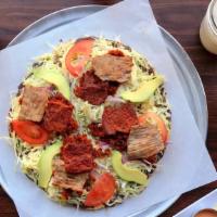 Tlayuda Vegetarian · Refried beans, unrefined pork lard, Oaxaca cheese, lettuce and sliced tomatoes, mushrooms an...