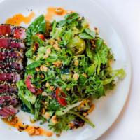 Seared Tuna Salad · sesame crusted yellowtail tuna, spinach, mixed greens, blistered tomatoes, cucumber, green o...