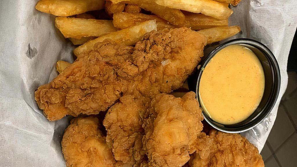 Chicken Tender Basket · Chicken tenders battered and fried to golden brown, and served with French fries