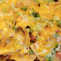 Irish Pizza · Fresh made nacho chips topped with sausage, green onions, diced tomatoes, green peppers and ...