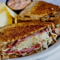 Reuben · Lean corned beef, sauerkraut and Swiss cheese on grilled rye bread served with a side of tho...