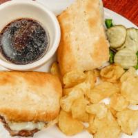 French Dip · Thinly sliced roast beef dipped in beef broth, served on a soft hoagie roll with Swiss chees...