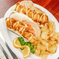 Fish Tacos · Fried cod, cabbage, onions and tomatoes topped with a spicy cream sauce.  Served in a warm t...