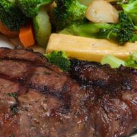 New York Strip · A 10 oz New York Strip steak chargrilled to your specifications and served with a baked pota...