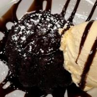 Volcano Cake · Warm ooey gooey chocolate cake served with vanilla ice cream and chocolate sauce