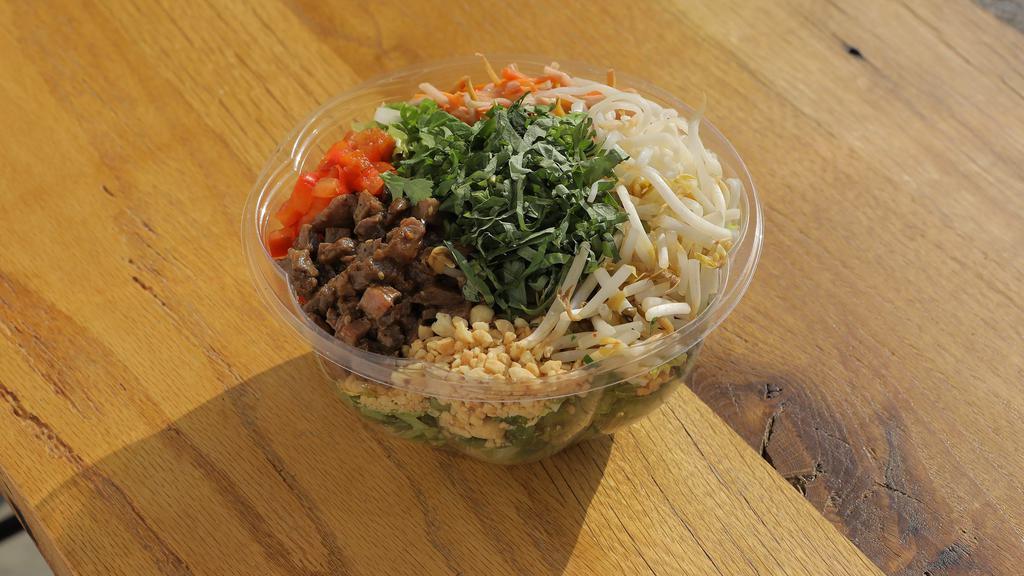 Thai Beef Tenderloin (Large) · romaine lettuce, napa cabbage, teriyaki beef tenderloin, green onion, red pepper, pickled carrot, rice noodle, bean sprout, peanut, fresh cilantro, and fresh basil. 
suggested dressing: spicy peanut.