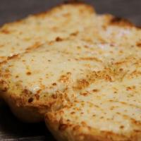 Garlic Cheese Bread · Three slices of fresh baked bread, seasoned with garlic butter and topped with Mozzarella ch...