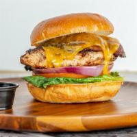 Yardie Chicken Sandwich · Grilled Jerk chicken breast. Served on a bun. Topped with caramelized onion, lettuce, tomato...