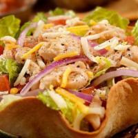 Taco Salad · A crispy, fried flour shell filled with beef or chicken and topped with beans, lettuce, chee...
