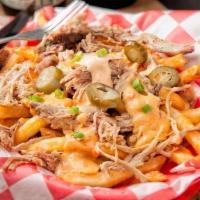 Loaded Fries · BBQ Queso, Jalapeno's, Chipotle Sour Cream, Green Onions, & Diced Red Peppers.  Sub Burnt En...