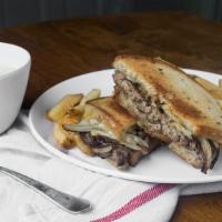 Patty Melt Burger · Grilled light rye bread with melted swiss cheese and sauteed onions. Served on a gourmet bri...