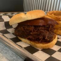 Big Bad Wolf · Our smoky joe (chopped brisket in mild sauce) and hot link on a large bun.