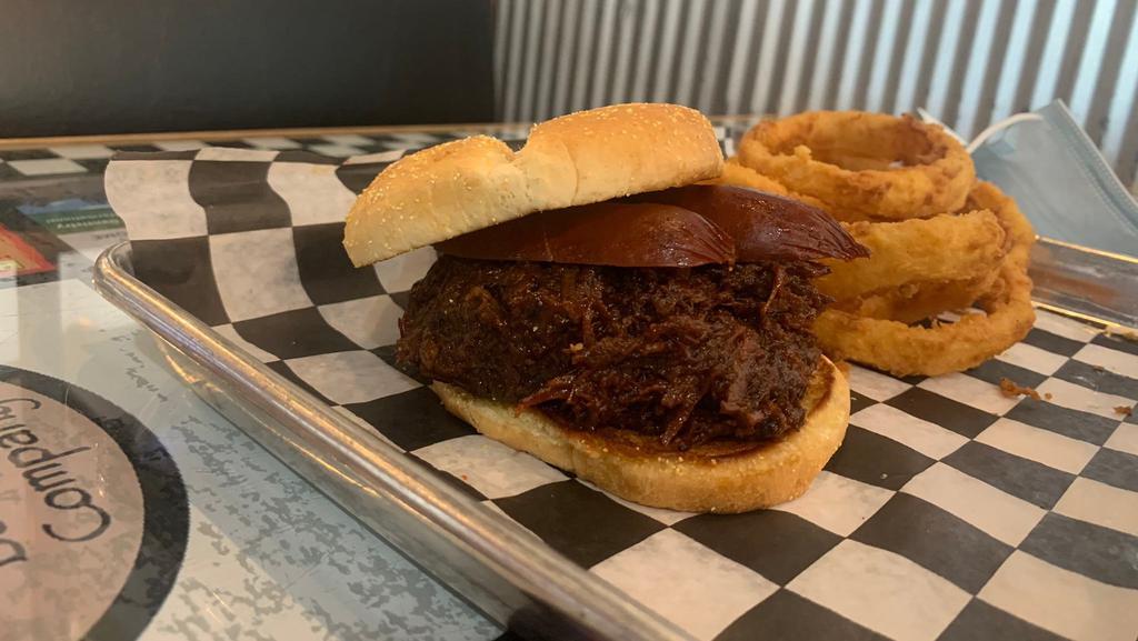 Big Bad Wolf · Our smoky joe (chopped brisket in mild sauce) and hot link on a large bun.