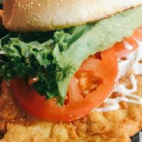 Porkloin Sandwich · Hand-breaded and fried pork loin sandwich with mayo, lettuce, and tomato. served on a large ...