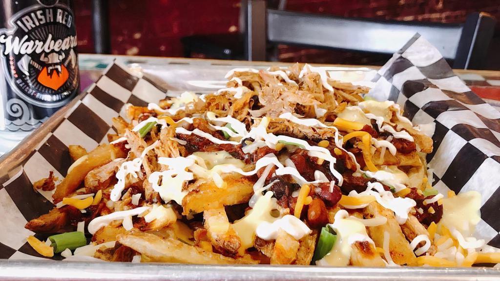 Loaded Chili Cheese Fries · Large order of seasoned fries, loaded with baked beans, cheese queso, your choice of 1/4 pound of meat, green onions, and sour cream.
