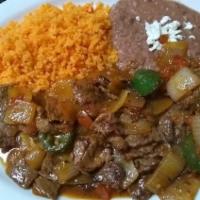 Bistec A La Mexicana · Grilled steak with diced onion, tomato, and jalapeño pepper.