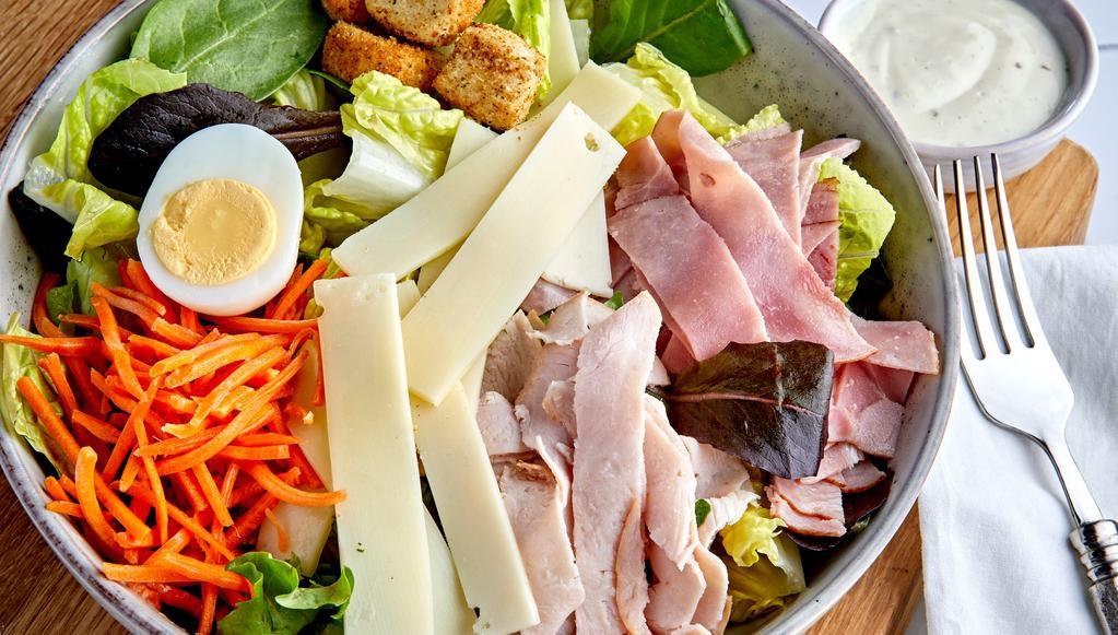 Chef'S Salad · Chopped Romaine, Spring Mix, Tomatoes, Cucumber, Egg,  topped with Ham, Turkey, & Swiss Cheese, Ranch Dressing on side