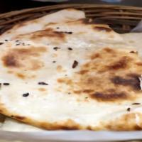 Naan · Indian bread made of super fine white flour doug and baked in our tandoor.