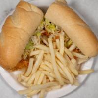 Fried Shrimp Po Boy · Served on a French roll with green pepper, onion, lettuce, tomato, and house sauce - mild sp...