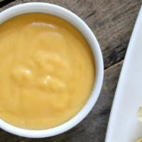 Spicy Cheese Sauce · Amigos Spicy Cheese Sauce made from scratch.