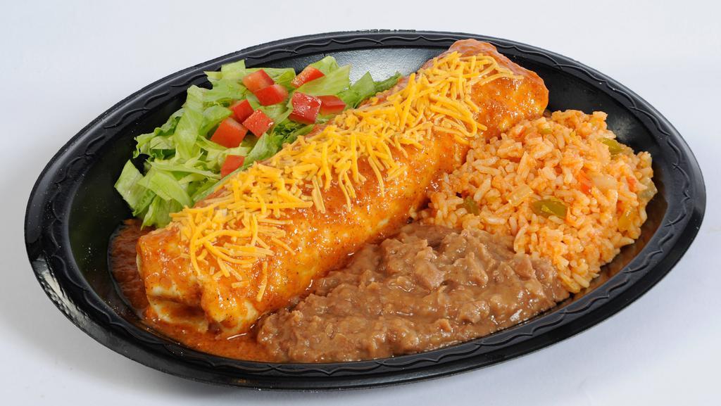 Meat Enchilada · Seasoned ground beef, monterey jack cheese, and onions rolled in a flour tortilla then topped with enchilada sauce and cheese sauce.