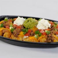 Mexi Fry Nacho · Golden, crisp mexi fries covered with refritos, ranch dressing, cheese sauce, and seasoned g...