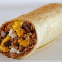 Grilled Grande Burrito · Southwest chicken, steak, or taco meat with refritos, crumbled mexi fries, cheese sauce, and...